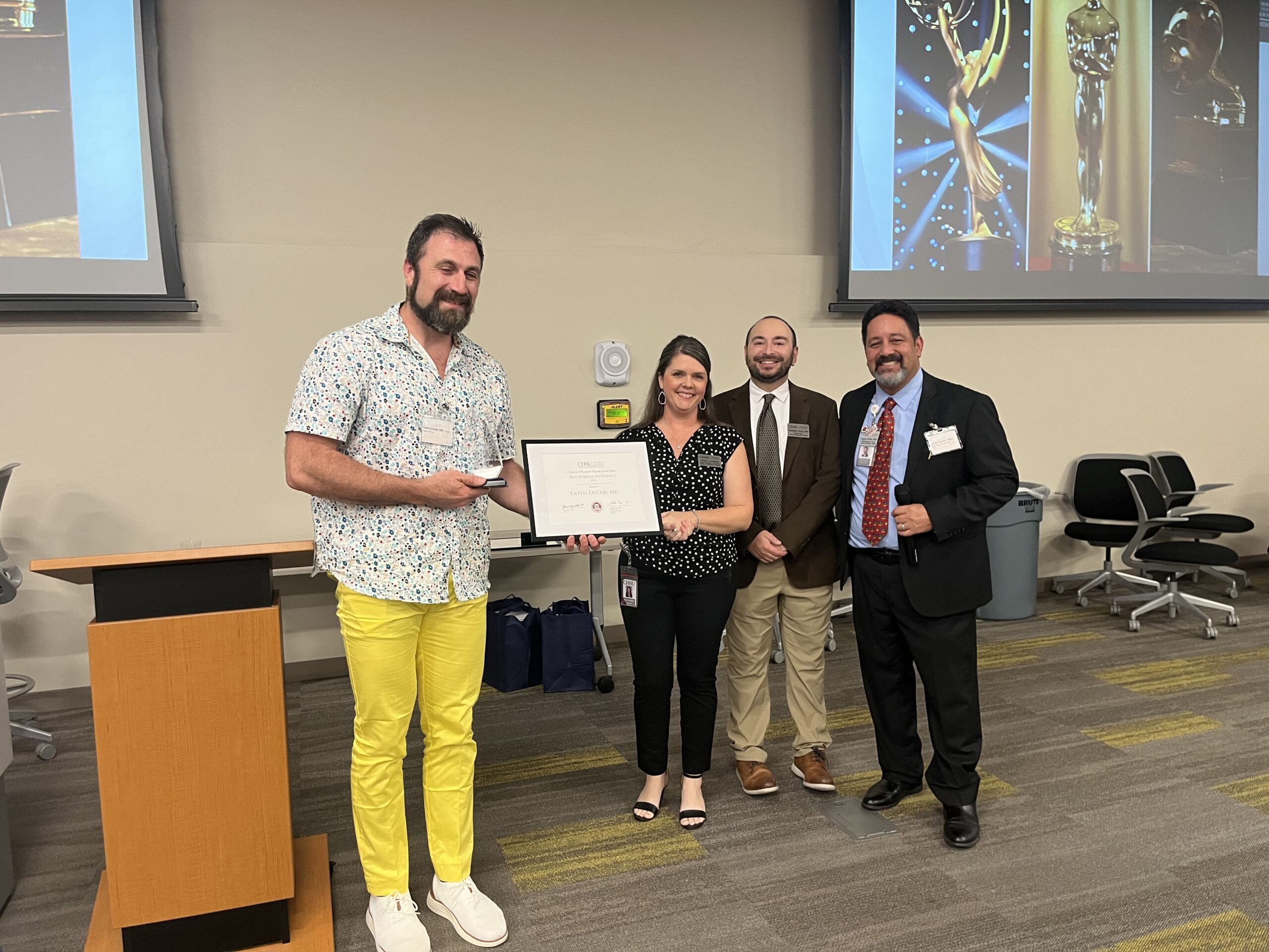 Dr. Entabi receiving CHSU’s 2024 Best Overall Experience Clinical Faculty Preceptor award
